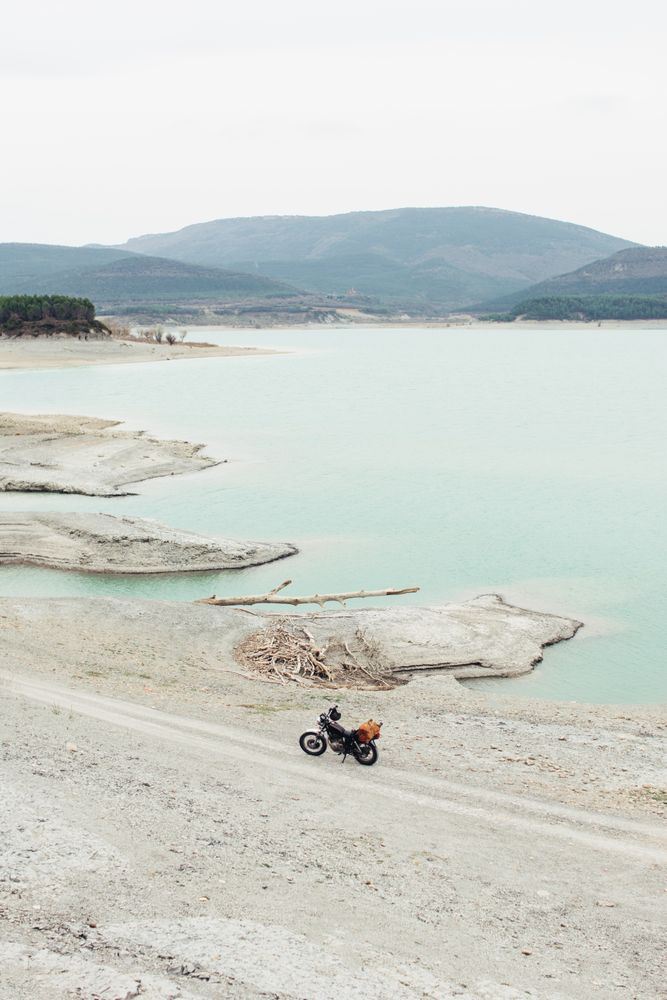 Motorcycle near calm lake