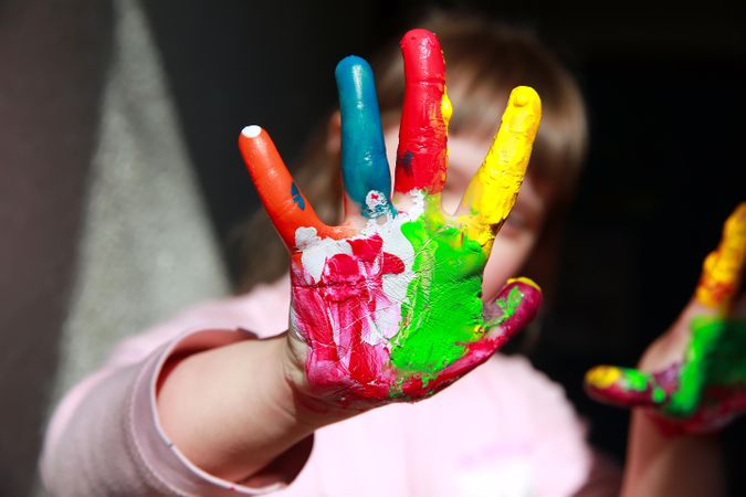 Close up of young childs painted hand