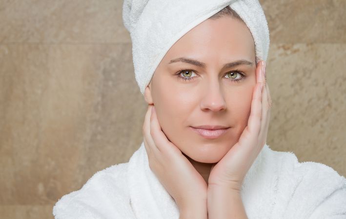 Portrait of woman with a white bathrobe