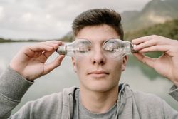Young teenager with light bulbs on eyes