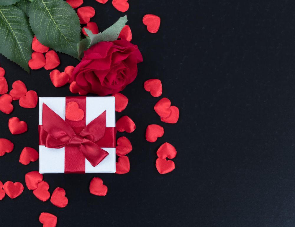 Valentine gifts on dark stone setting