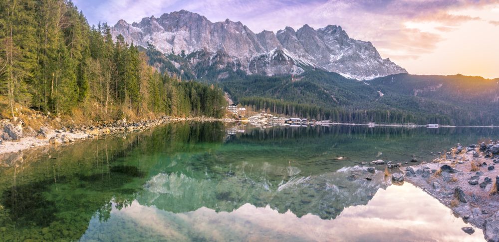 The Alps reflected in water at sunset