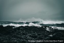 Waves of the Atlantic Ocean crashing into Iceland rugged coast 4mVovb