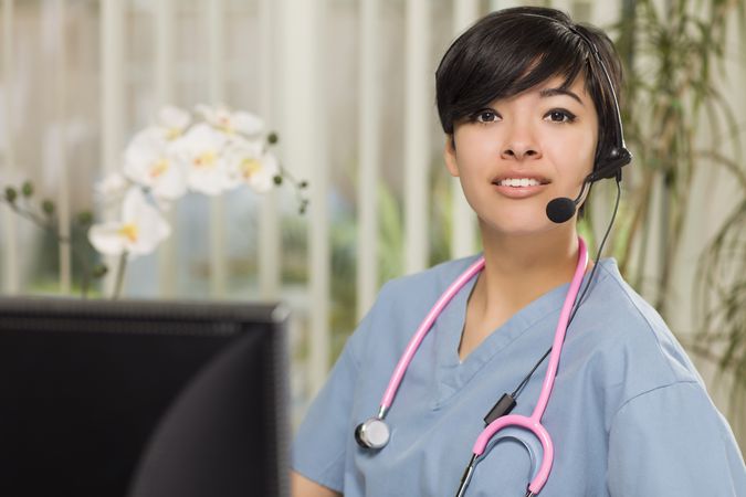 Female Nurse Practitioner or Doctor at Computer