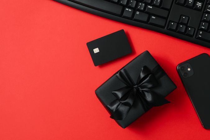 Sale concept with gift box on red background