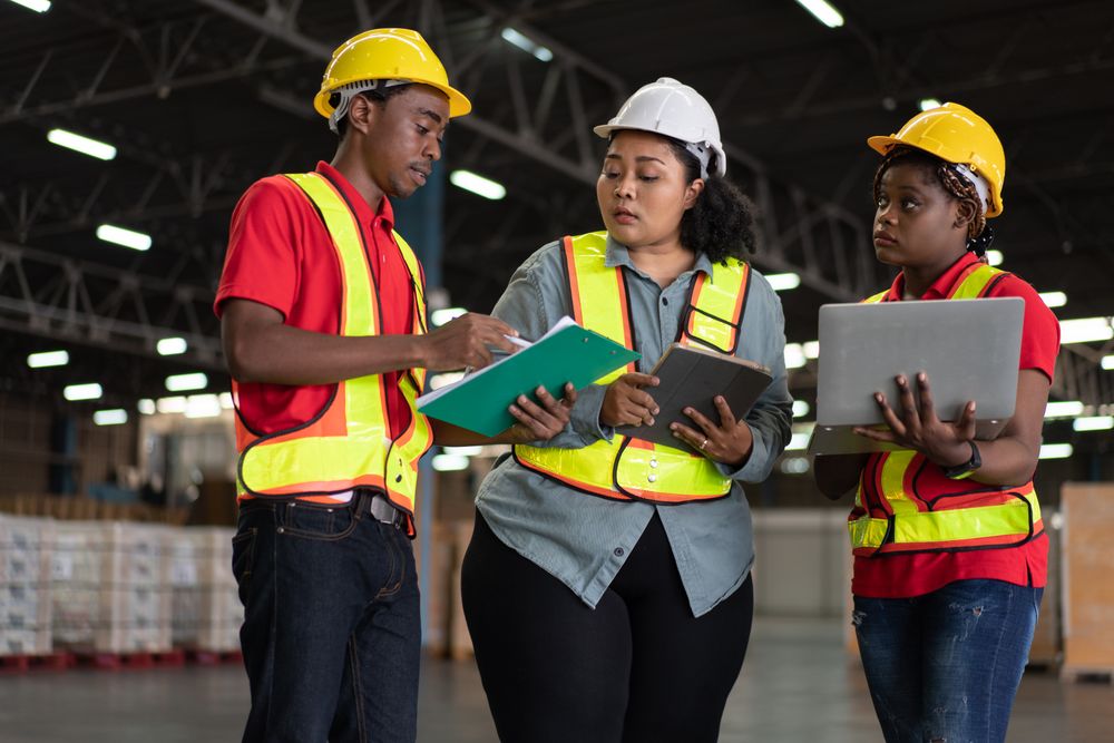 Group of logistic staff working at warehouse