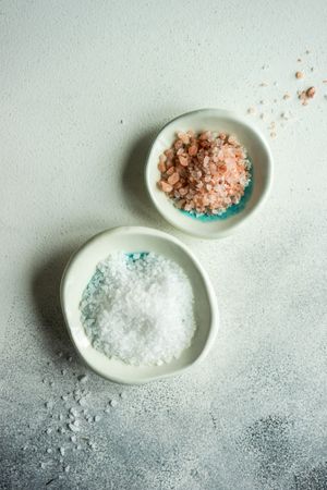 Two small bowls of sea salt & Himalayan salt