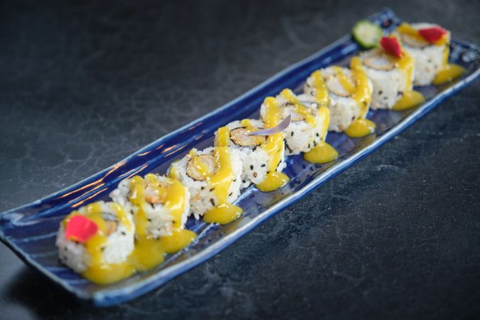 Delicious sushi pieces with battered prawns and soy sauce