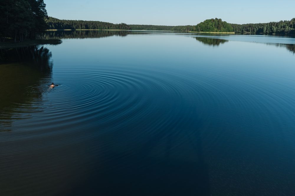 View of calm large lake and tourist