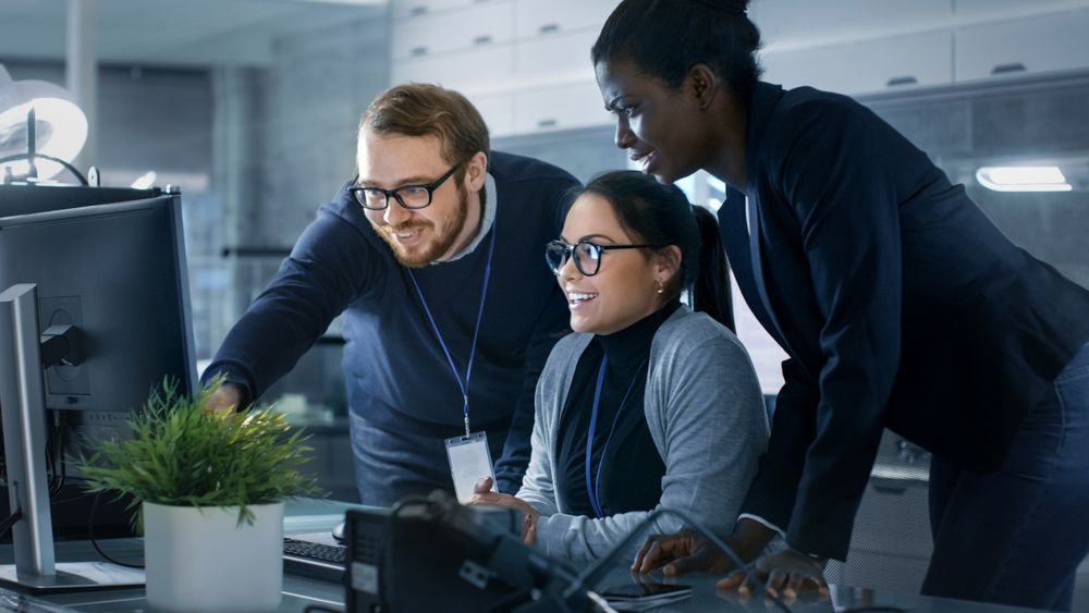 Diverse Team of Research Engineers Working in a high Tech Laboratory on a High Profile Start-up.