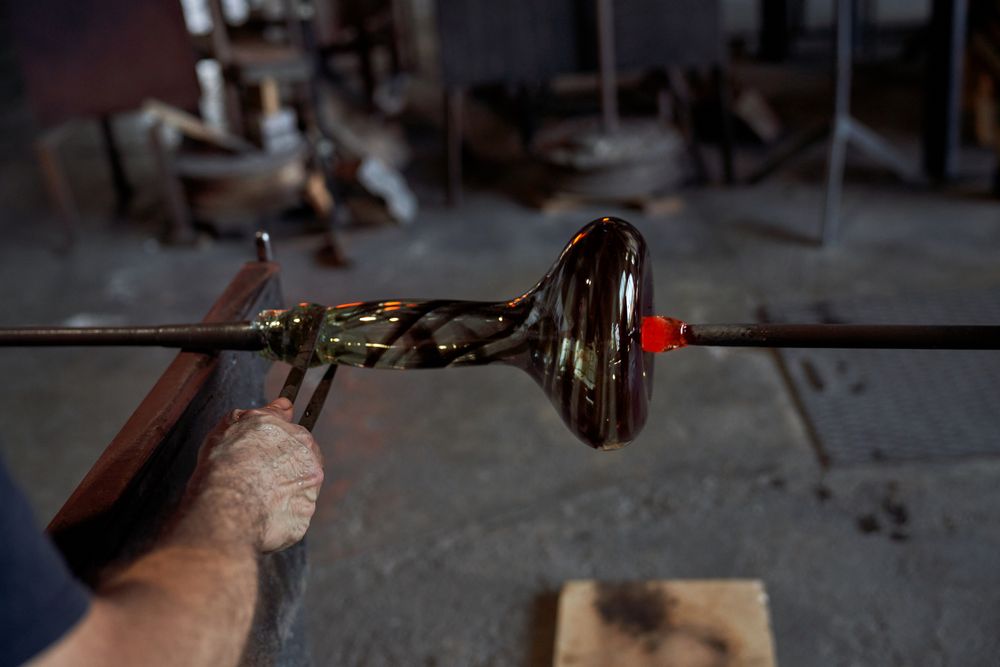 Crop craftsman making hookah base using jacks