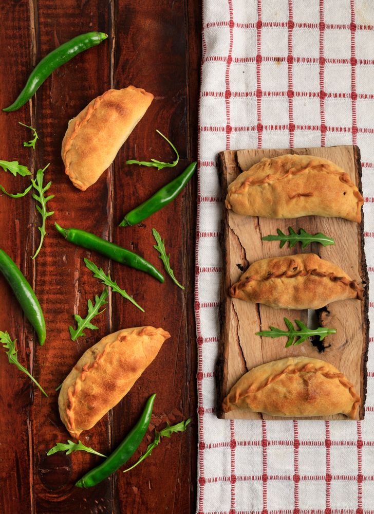 Set of patties between herbs and chili on napkin