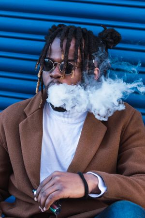 Hipster Black man with electronic cigarette