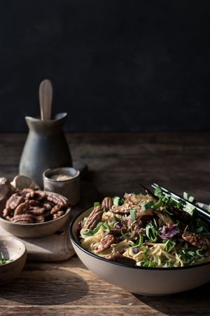 Miso noodles with egg plants and shiitake in bowl on table