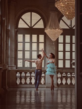 Talent pair dancing together in hall of cathedral