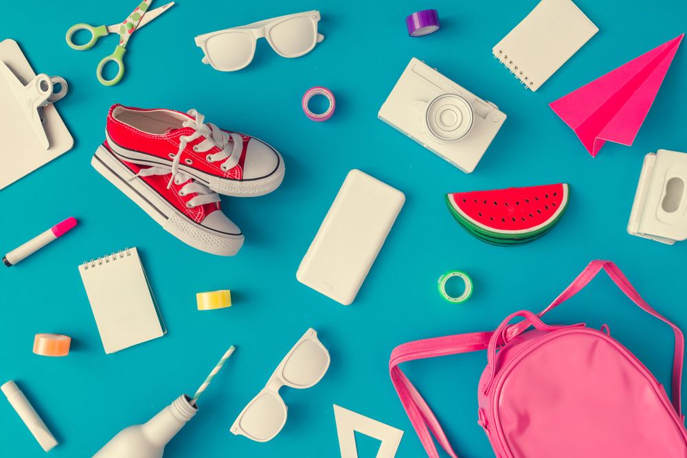Back to school supplies on bright blue background