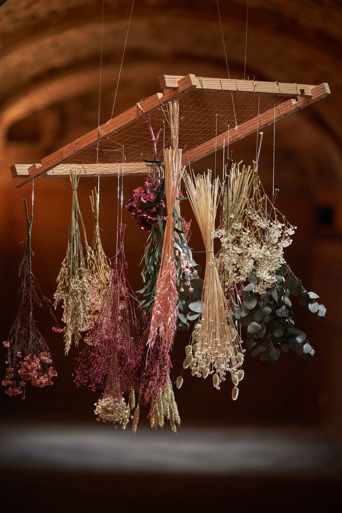 Bunches of withered flowers on frame