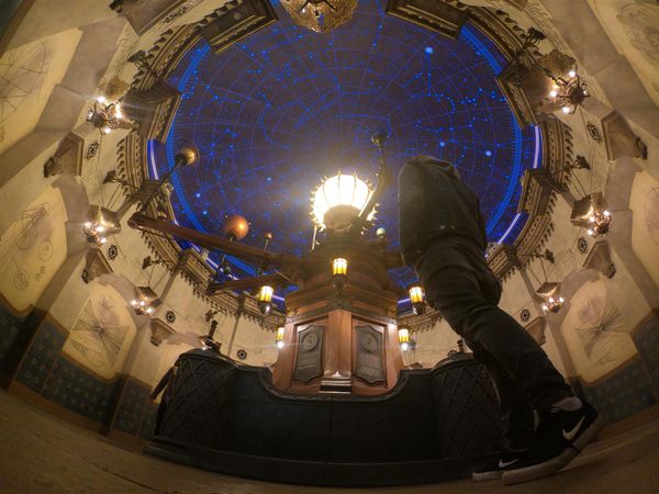 Man standing under glass ceiling at night in Urayasu, Chiba, Japan