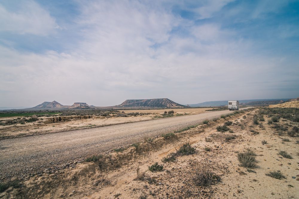 trailer on empty road along desert