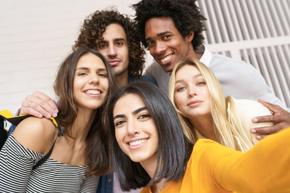 Friends having fun taking a picture outside
