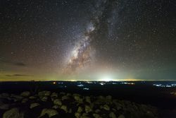 Milky way galaxy with knob stone ground is name Lan Hin Pum viewpoint at Phu Hin Rong Kla National Park in Phitsanulok, Thailand