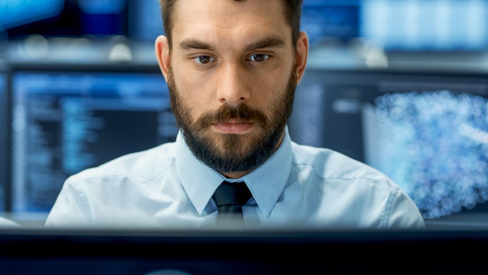 Neural Network and Machine Learning Engineer Working Hard at His Workstation.