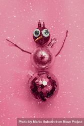 Pink snowman made out of Christmas decorations 0vLOL4