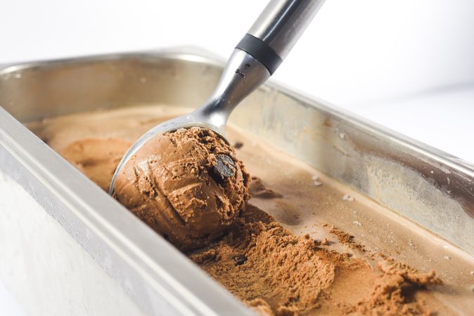 Scooping out a ball of delicious chocolate chip ice cream