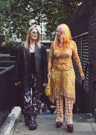 London, England, United Kingdom - September 18 2021: Two woman in bold patterns walking outside