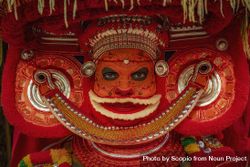 Portrait of an Indian man disguised as Theyyam Hindu deity 49Ydv4