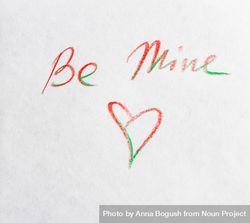 Valentine Day holiday card concept with "Be Mine" and heart written on paper 4266gy