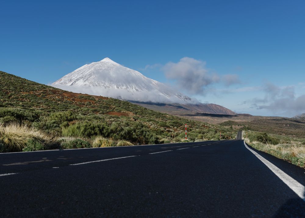 Countryside road near snowy mountain peak