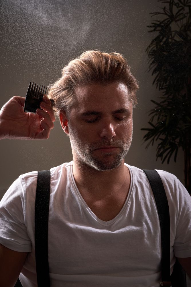 Portrait of man getting haircut