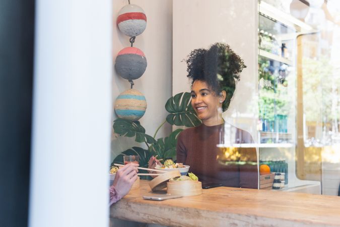 Diverse friends eating in restaurant together