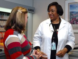 Bethesda, MD - USA, July 2006: A Black doctor speaks with a patient at the NCI 0y7pW4