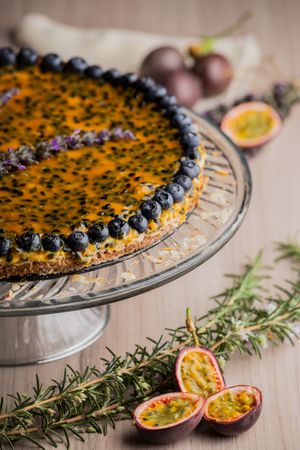 Tasty passion fruit pie decorated with blueberry
