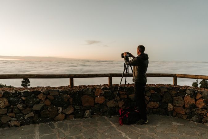 Photographer taking shot of hill view