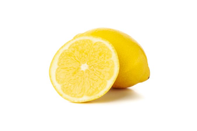 Fresh lemon isolated on light background. Ripe fruit
