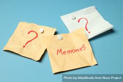 Scattered post it notes with the word “memories” in blue room bGyz25