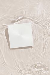 Paper card floating in water