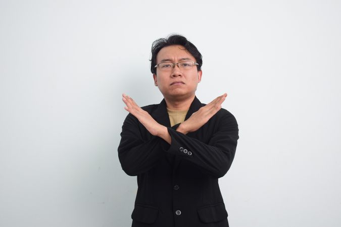 Asian Businessman gesturing stop