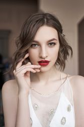 young confident woman with red lips looking at camera