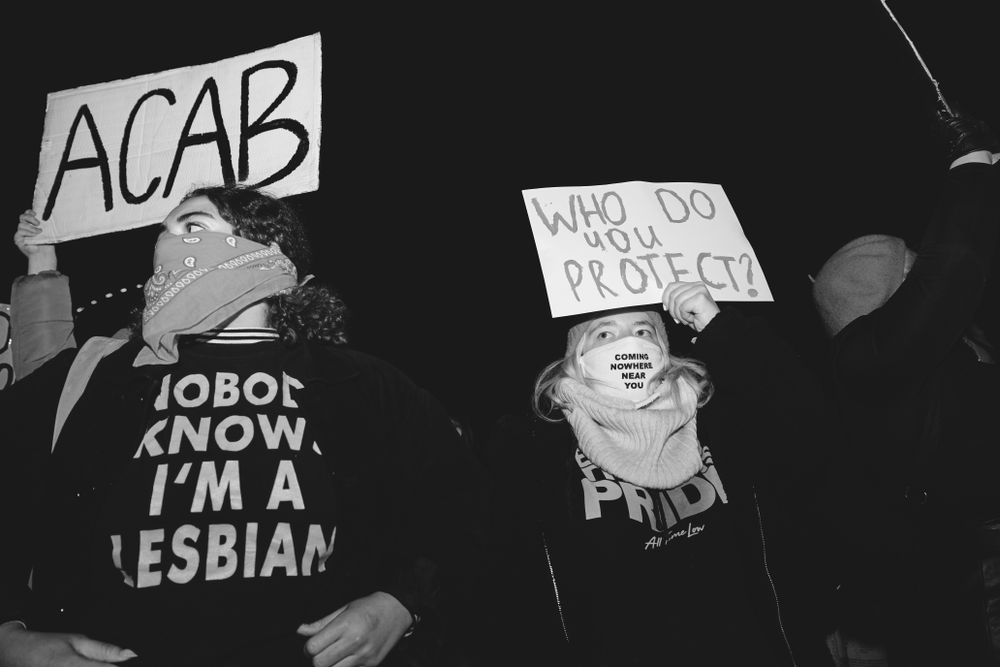 London, England, United Kingdom - March 16, 2021: Female protesters with anti-police brutality signs
