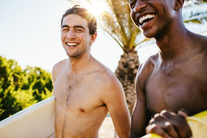 Two young men going surfing