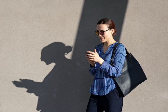 Smiling businesswoman using the cellphone