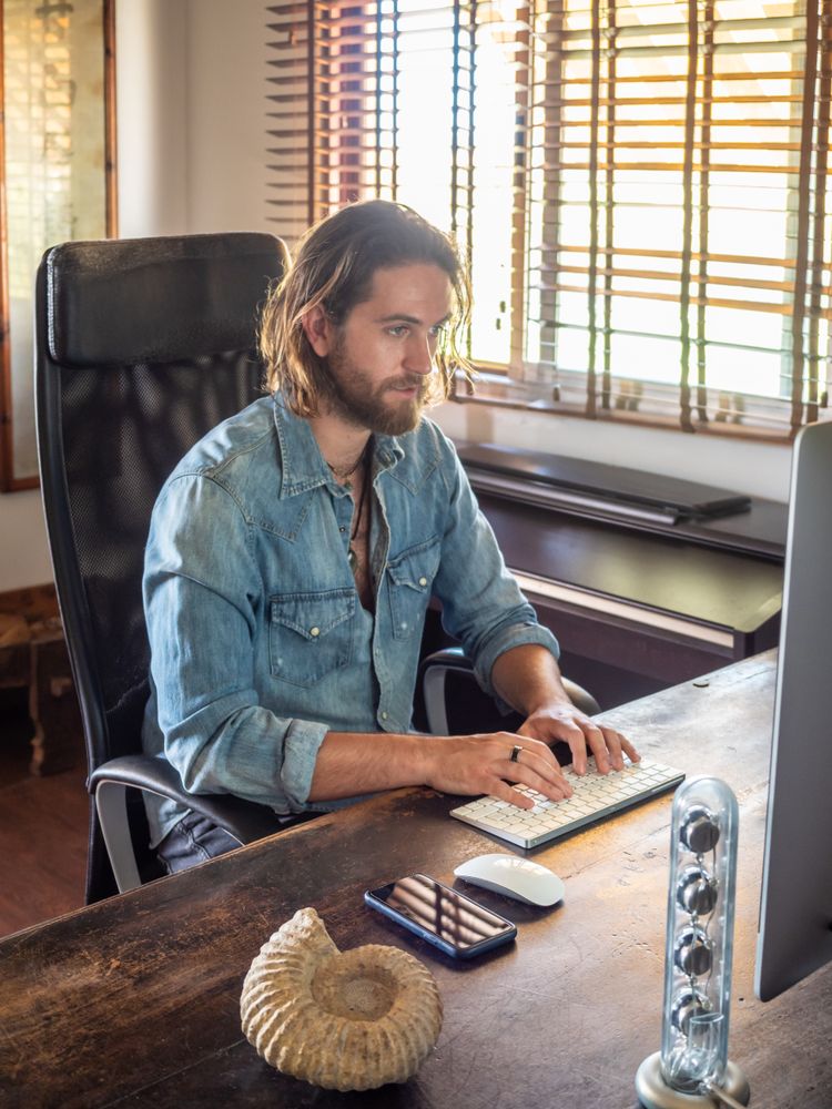 Man using computer in apartment