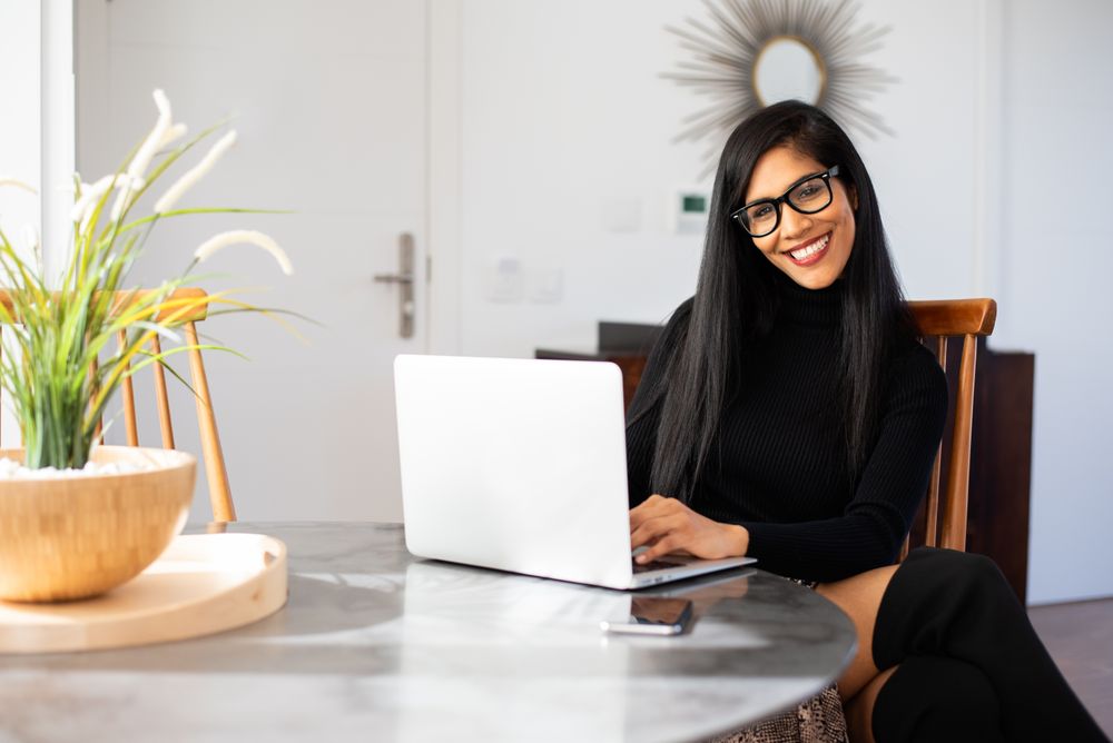 Businesswoman working from home on her computer
