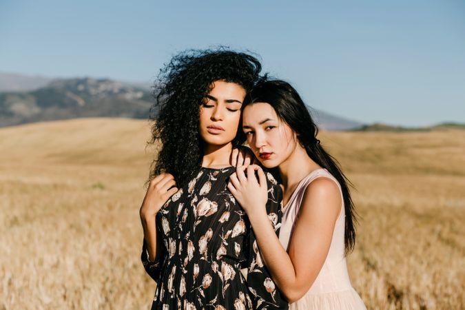 Female friends standing in field