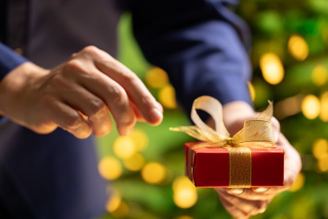 Man About to Open Christmas Gift
