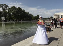 Nun holding photograph at BLM demonstration, Washington, D.C.